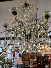 Load image into Gallery viewer, Antique / vintage Candelabra with 6 ornate Brass arms with an abundance of crystal swags &amp; prism drops.

