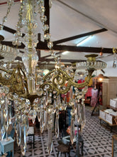 Load image into Gallery viewer, Antique / vintage Candelabra with 6 ornate Brass arms with an abundance of crystal swags &amp; prism drops.
