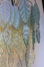 Load image into Gallery viewer, Original Bespoke botanical Chandelier. leaves cascade from 48 branches. These unique glass leaves are created from Recycled glass.
