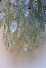 Load image into Gallery viewer, Original Bespoke botanical Chandelier. leaves cascade from 48 branches. These unique glass leaves are created from Recycled glass.

