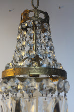 Load image into Gallery viewer, Empire Chandelier. Vintage crystal Light With Elegant Art Nouveau detailed brass frame. Complete with original ornate ceiling rose.
