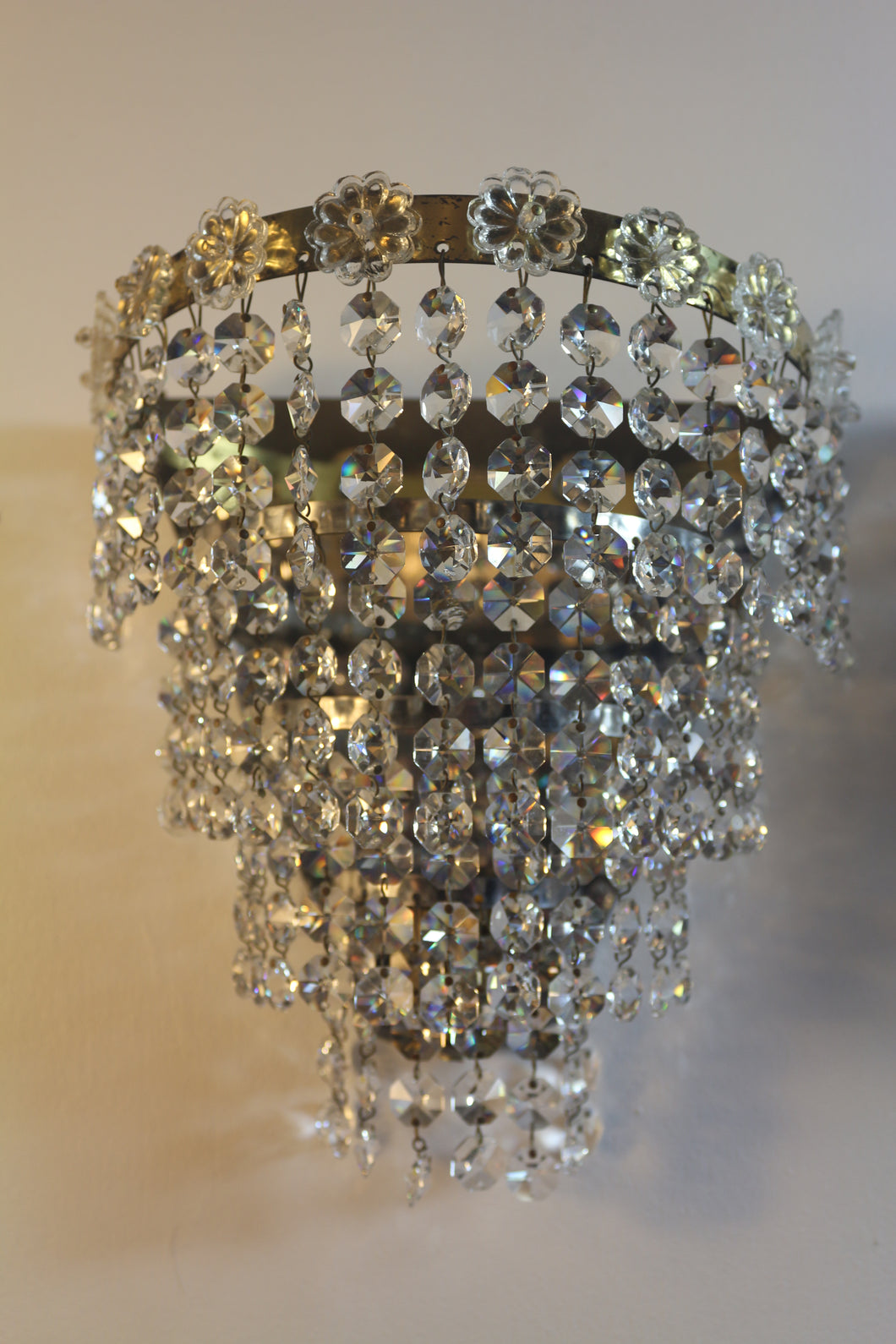 Vintage Brass Framed 4 Tiered crystal Waterfall Wall-lights, flower rosettes detail on the top rim & backed with a mirror.