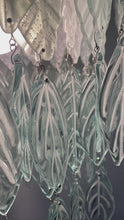 Load and play video in Gallery viewer, Original Bespoke botanical Chandelier. leaves cascade from 48 branches. These unique glass leaves are created from Recycled glass.

